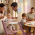 baby sitting on growwithme embo high chair pomegranate purple